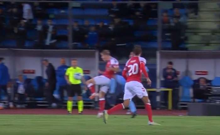 Rasmus Hojlund pictured being kneed in the back during Denmark's 2-1 win over San Marino in October 2023